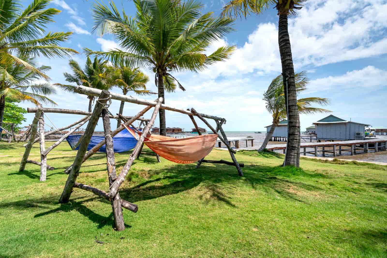 Hammock suspended from a steel stand on a patio